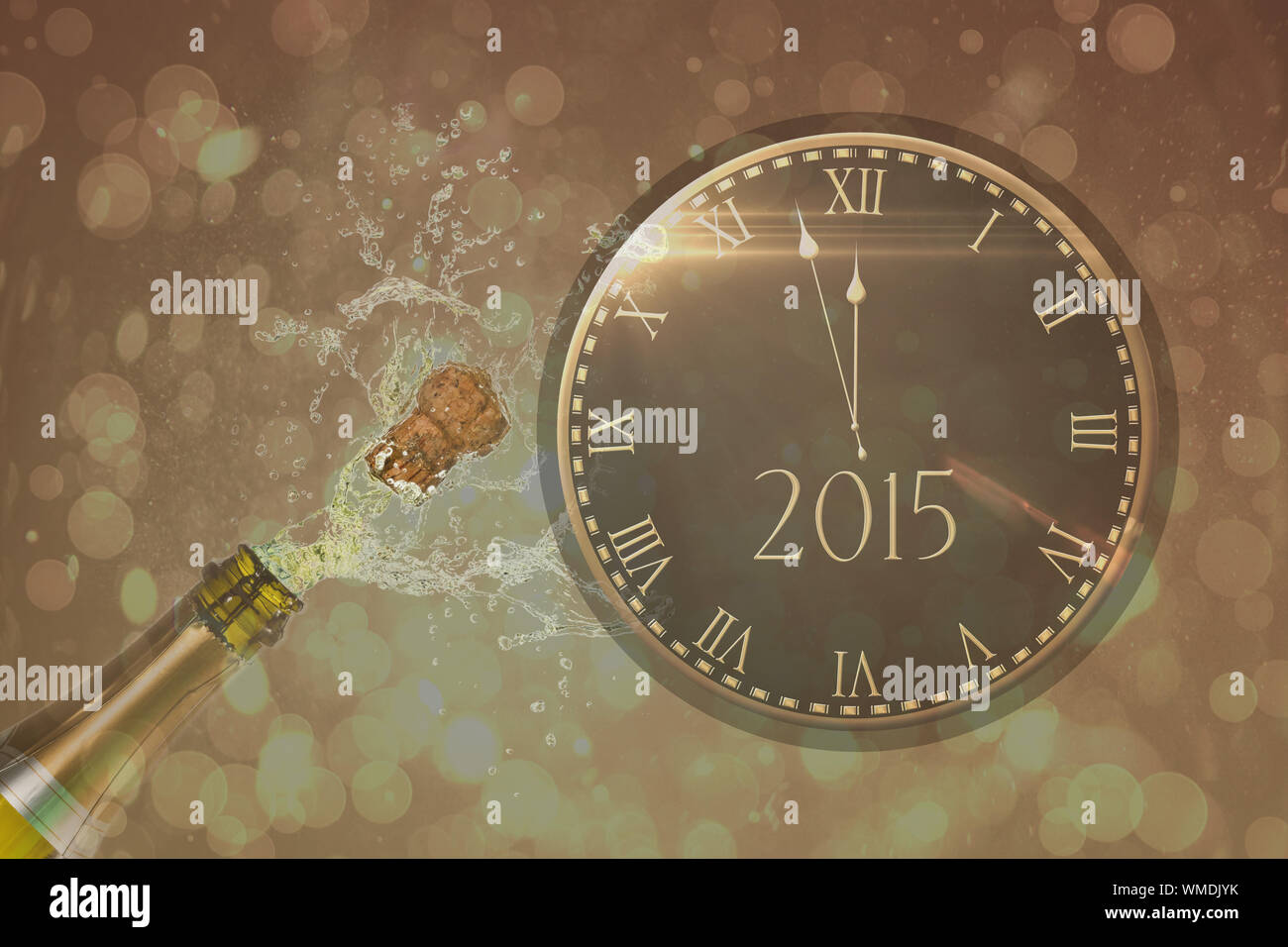 Clock counting down to midnight against champagne popping stock photo