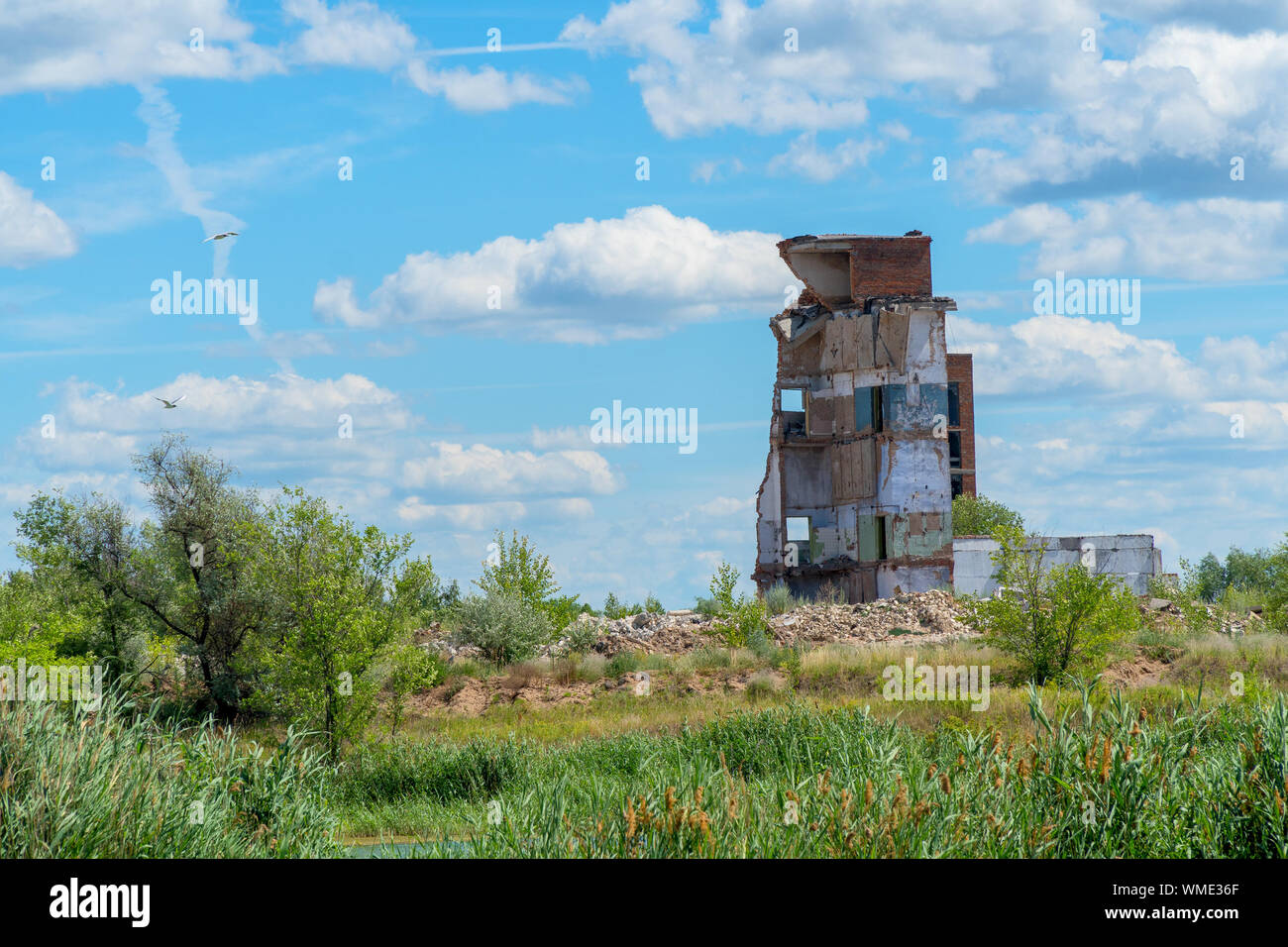 The remains of the ruins of the old building against the cloudy sky ...