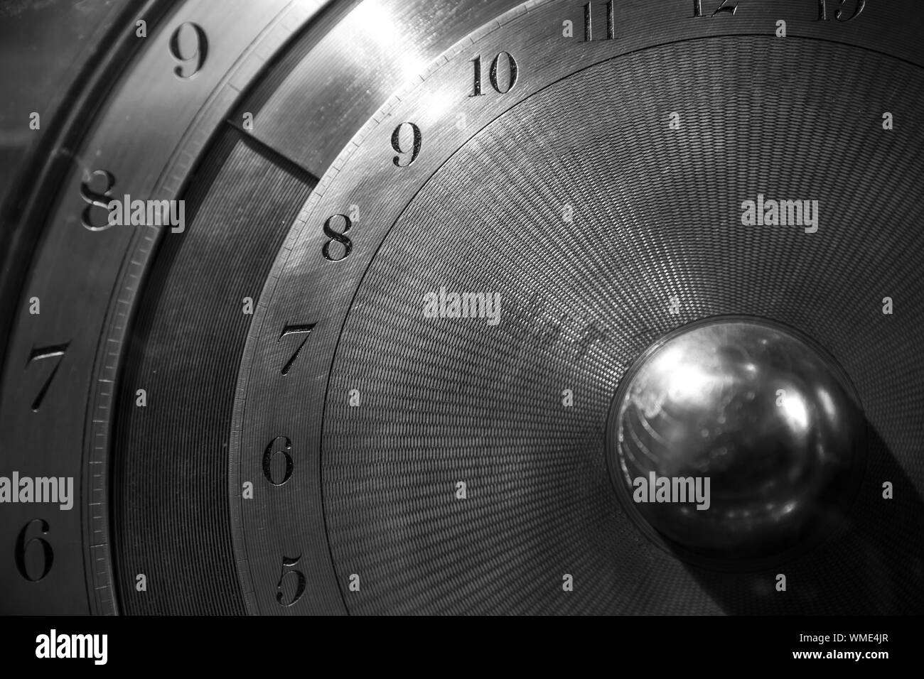 Old mechanical world clock deal, close up photo, selective focus. Black