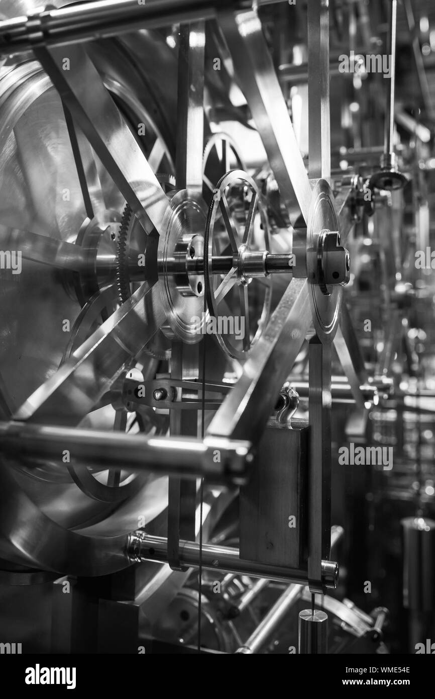 Vintage world clock mechanism. Black and white, retro style vertical