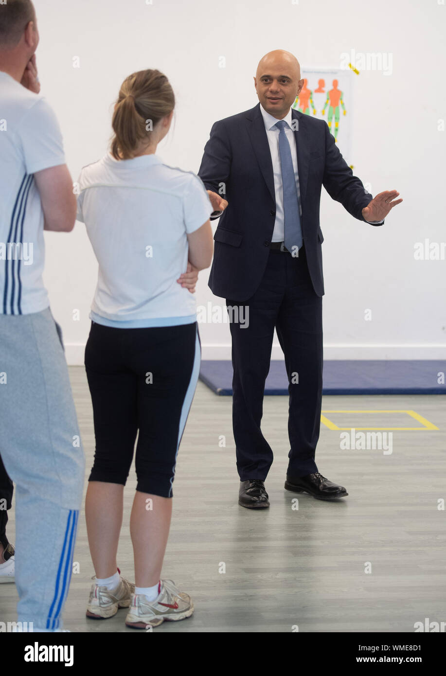 Chancellor of the Exchequer Sajid Javid meets police recruits taking part in a self defence class during a visit to the Metropolitan Police training college in Hendon, north London, after he promised £750 million in yesterday's spending review to fund the first year of a plan to recruit an extra 20,000 police officers. Stock Photo