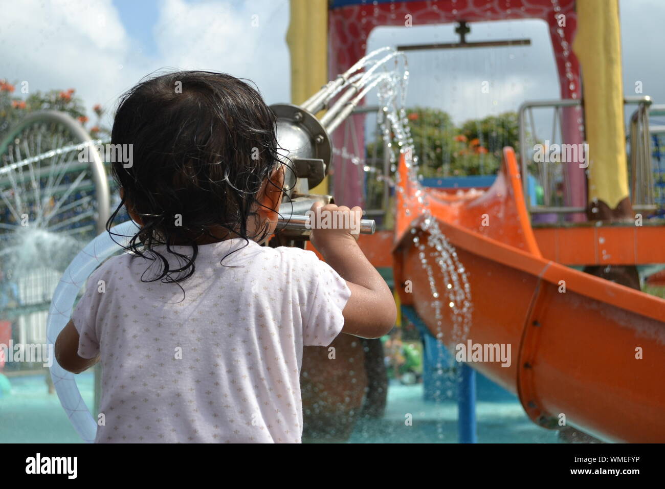Rear View Of A Child Playing Stock Photo - Alamy
