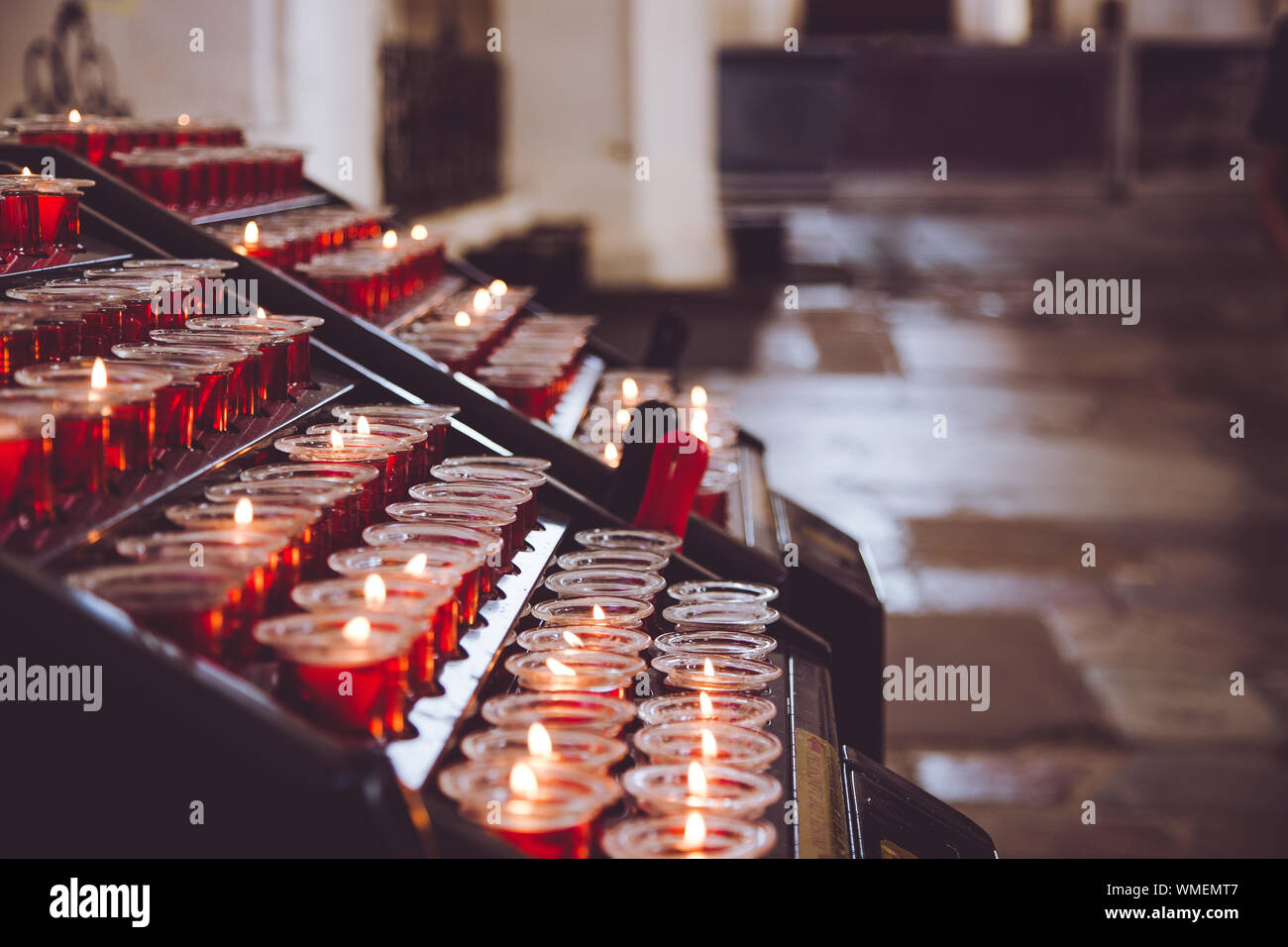 Candles in the Church. Votive prayer candles inside a catholic church