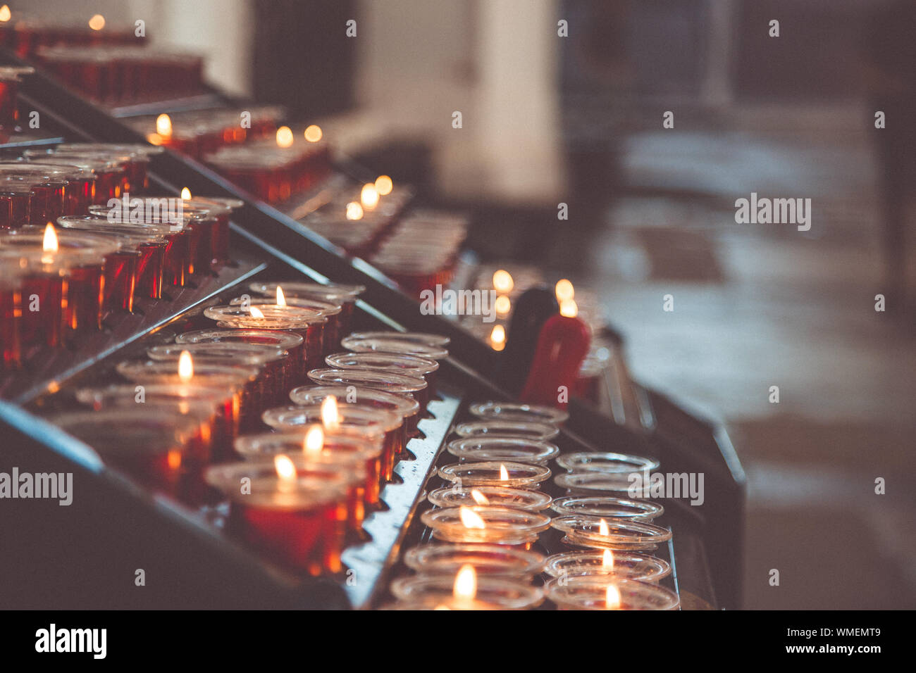 Candles in the Church. Votive prayer candles inside a catholic church