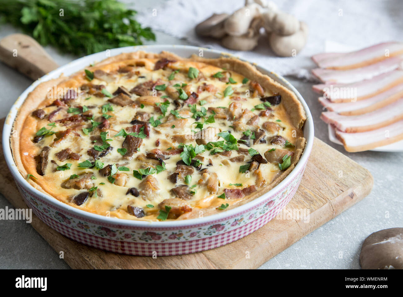 Homemade quiche lorraine with chicken, mushrooms, cheese and bacon