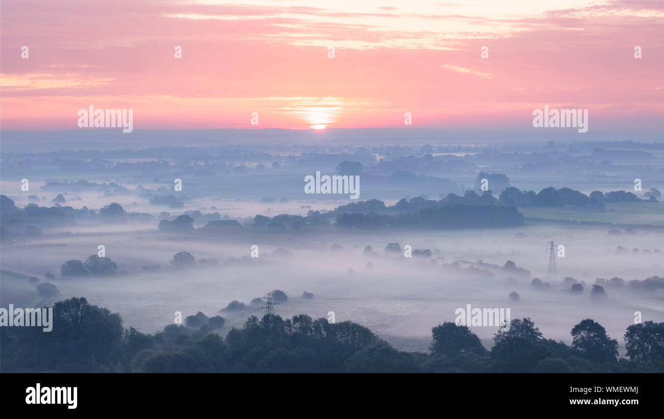 A beautiful misty sunrise over Sussex countryside near Lewes Stock Photo
