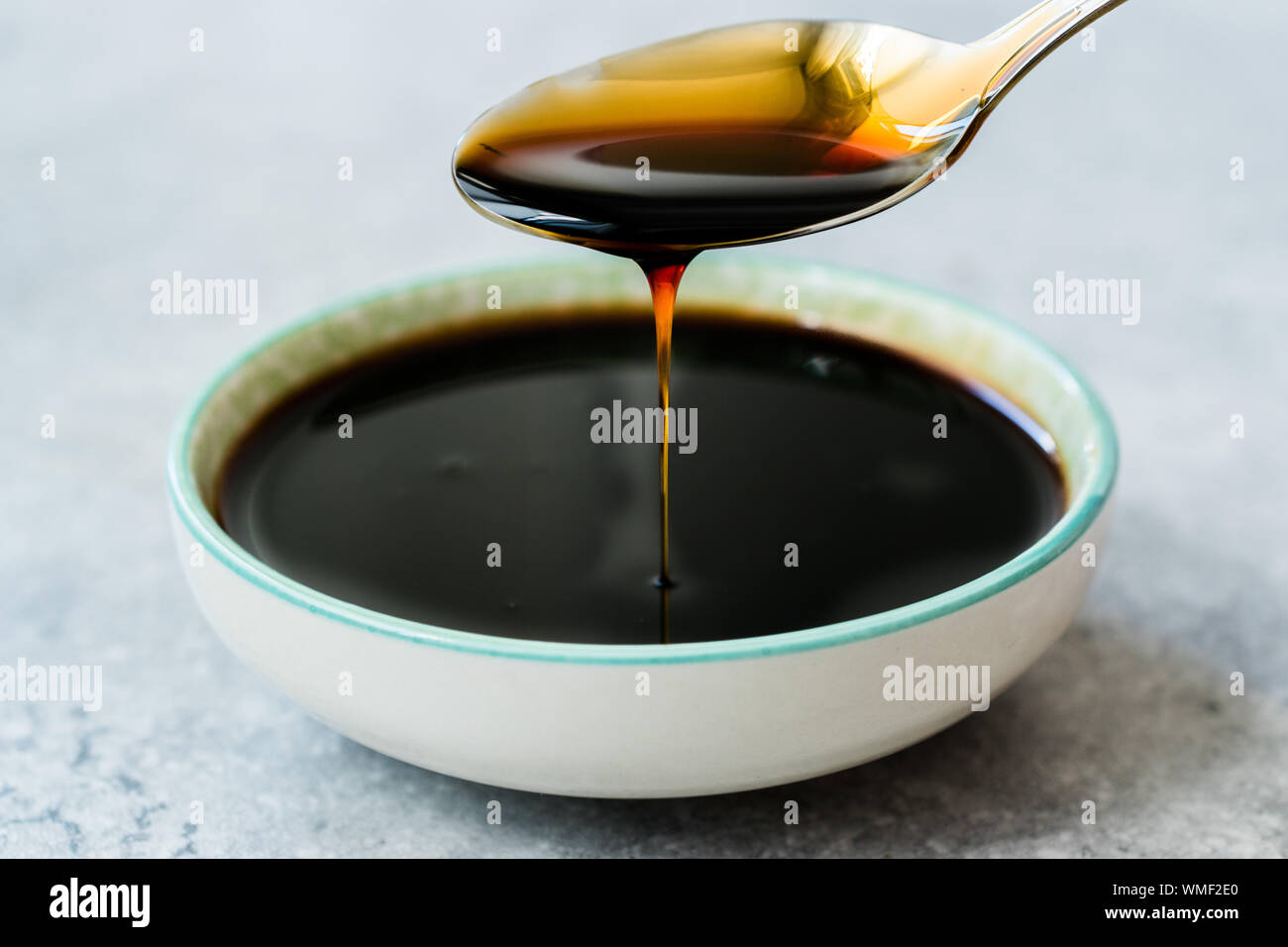 Organic Black Cane Sugar Molasses Dripping from Spoon. Organic Food Stock Photo Alamy