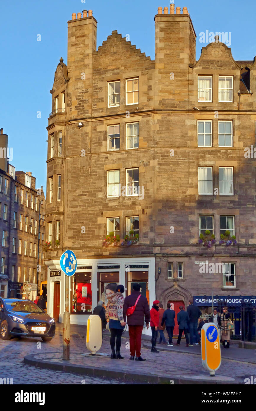 Afternoon winter sunshine turning the Edinburgh sandstone building, at