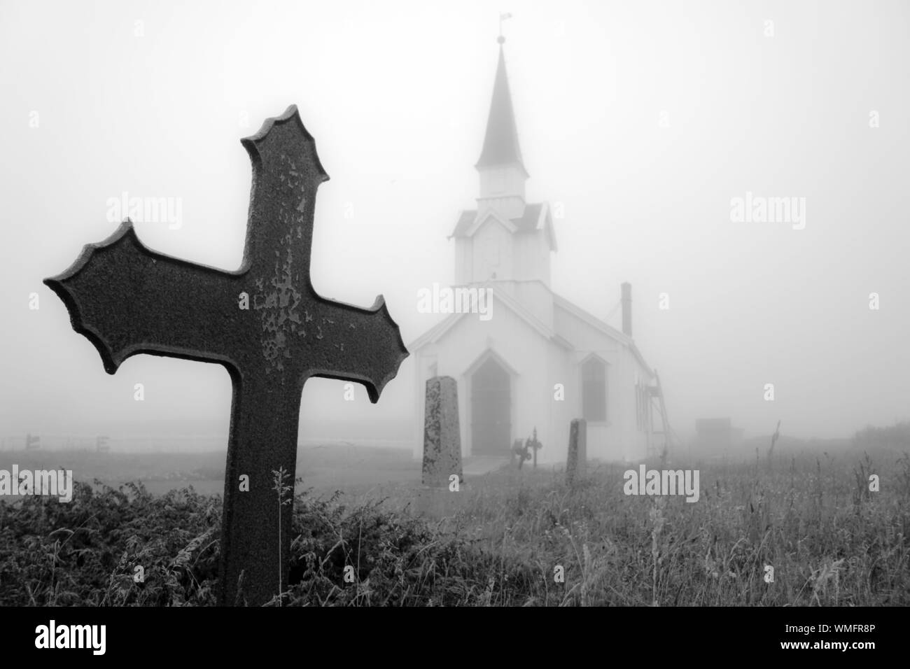 churchyard, old wooden church, graveyard, cemetery, grave, mysterious, obscure, fog, mist, foggy, misty, transience, Nesseby, Varanger, Norway Stock Photo