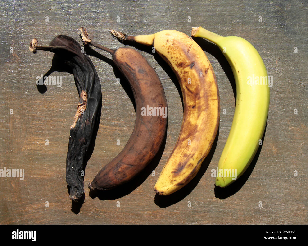 Aging Process Of Banana On Table Stock Photo