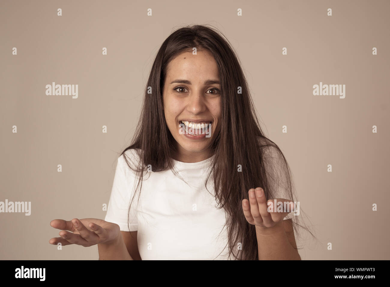 Portrait of beautiful shocked woman hearing good news or having great success with surprised and happy face. Making cheerful gestures. Facial Expressi Stock Photo