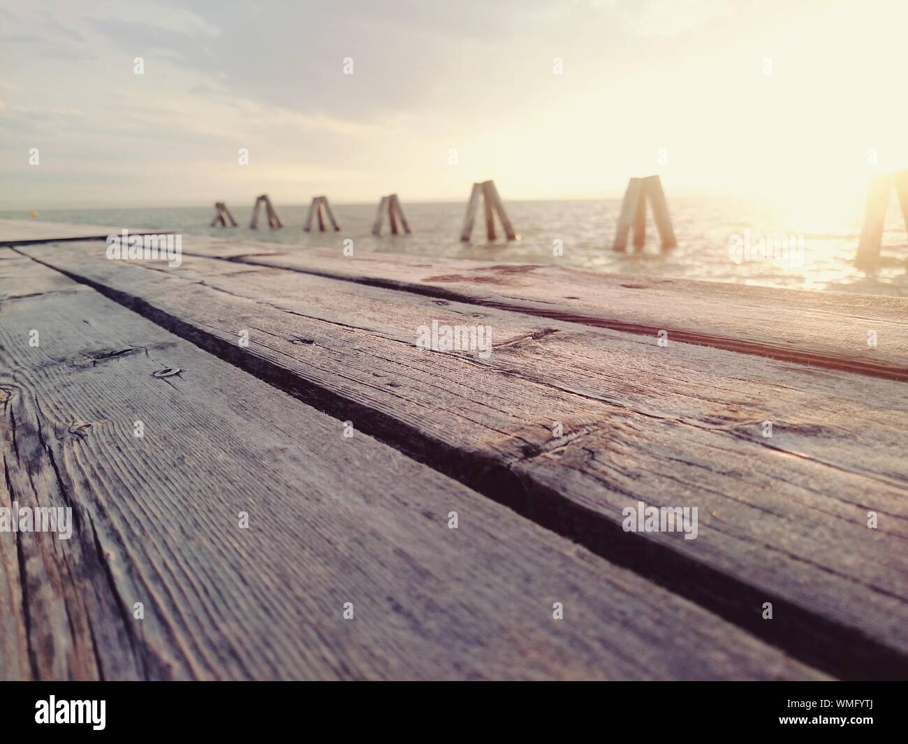 Wooden Pier At Lake Neusiedl During Sunset Stock Photo