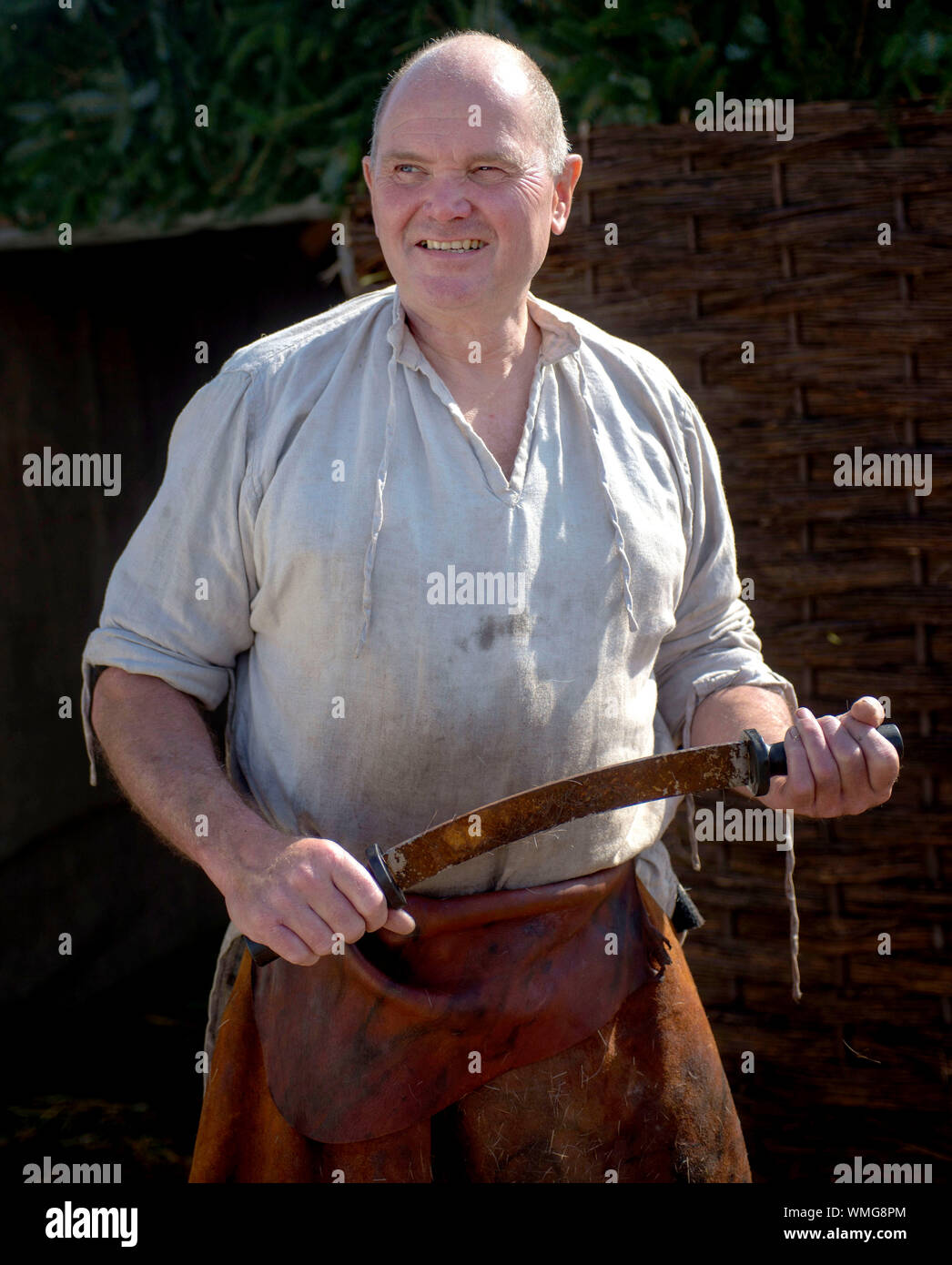 Largs, Ayrshire, UK. 05th Sep, 2019. Anthony a traditional tanner at the Viking village in Largs as part of the annual viking festival. Anthony works a deer skin. Thorfinn is the alter-ego of the Reverend Adrian Fallows. Credit: Chris McNulty/Alamy Live News Stock Photo