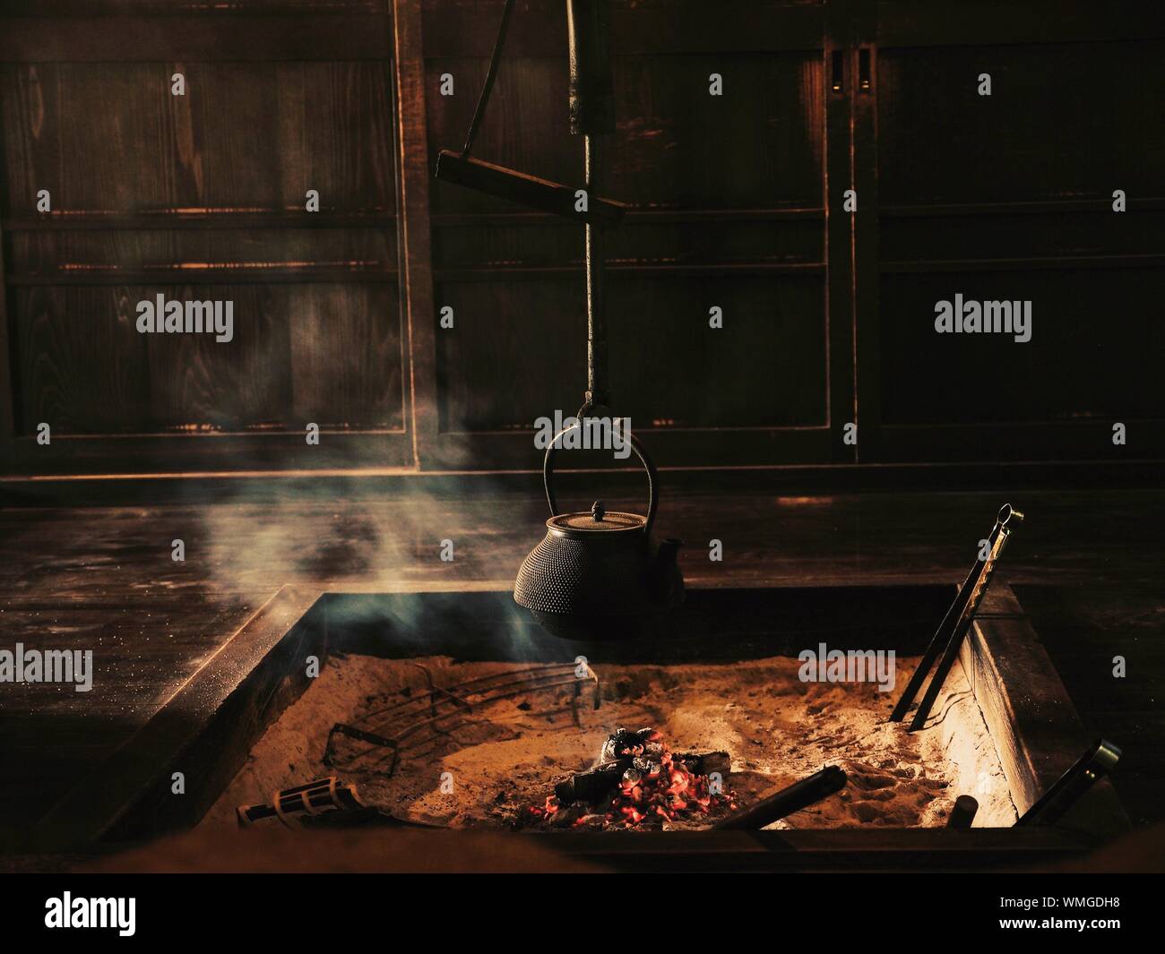 Kettle Hanging Over Fire Pit In Room Stock Photo Alamy