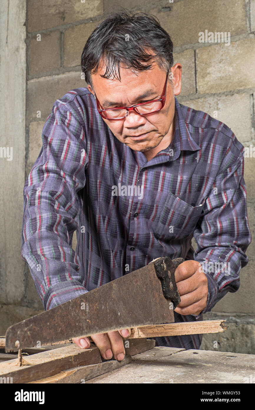 Carpenter Working In Carpentry Workshop Stock Photo