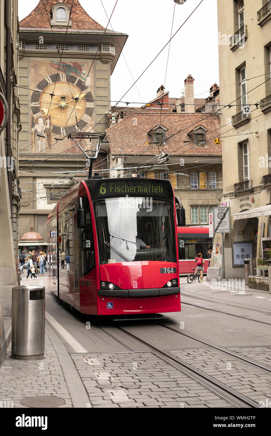 A number 6 tram stops in front of the Clock Tower (Zytglogge) in the old town center of Bern, Switzerland. Stock Photo