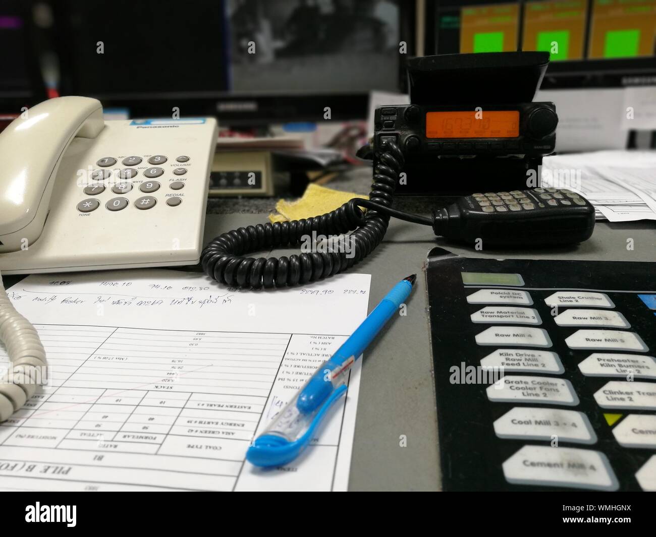 Close Up Of Landline Phones And Documents On Office Desk Stock