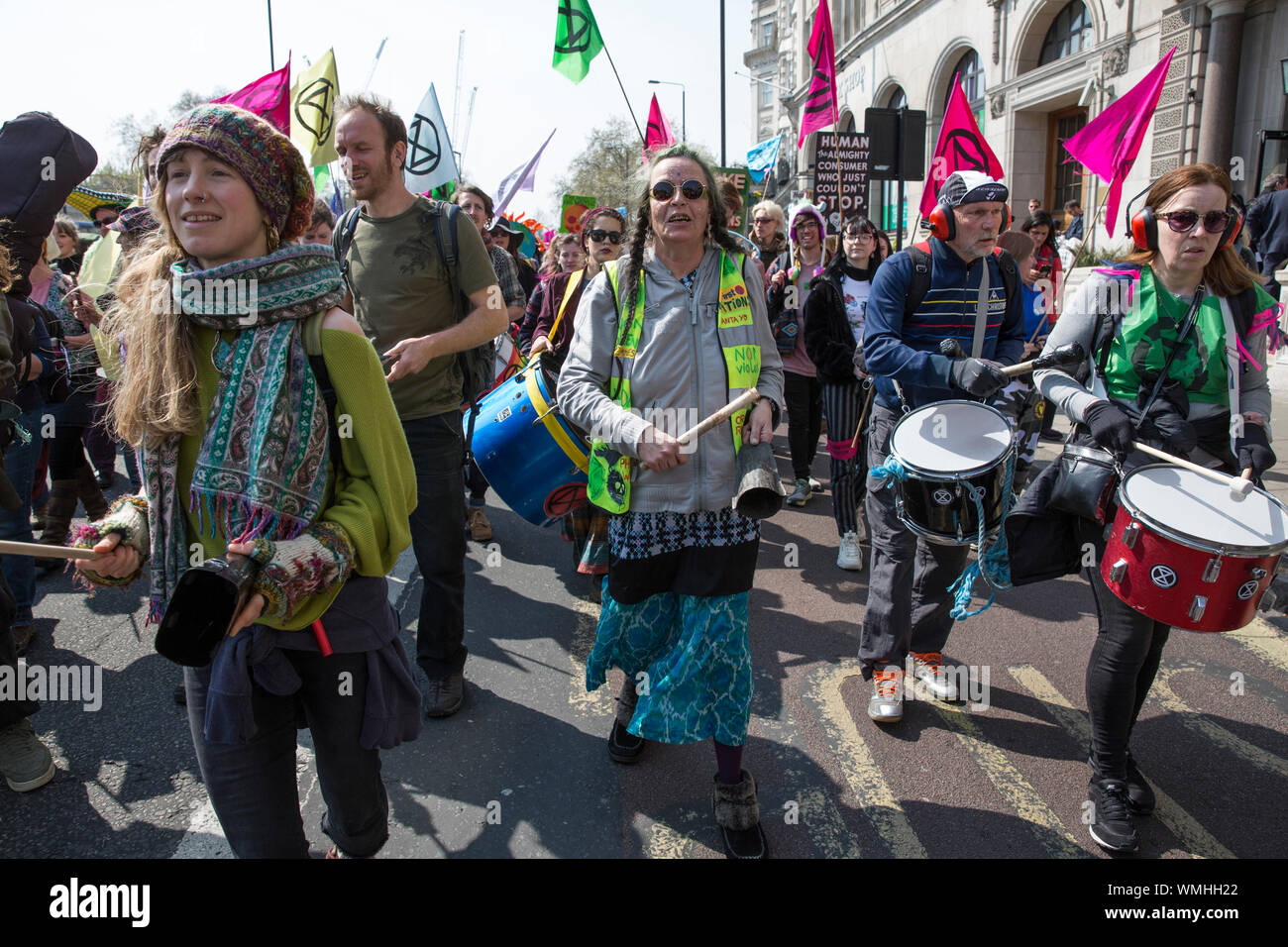 Extinction Rebellion protesters gather in Hyde Park Corner continuing the climate protest through Marble Arch congregating in Piccadilly Circus, UK Stock Photo