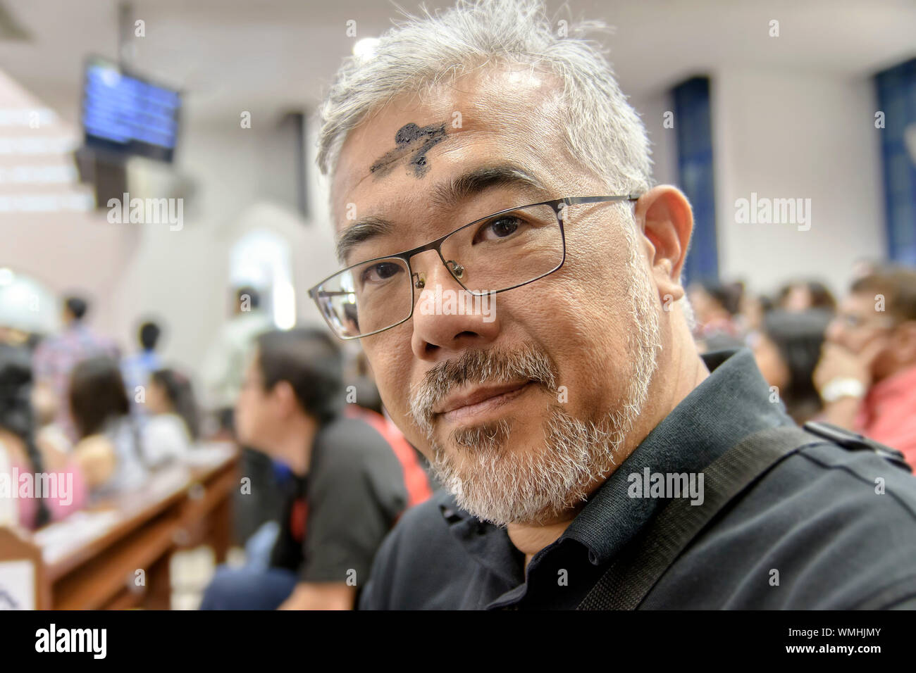 Close-up Portrait Of Mature Man With Ash On Forehead At Church Stock Photo