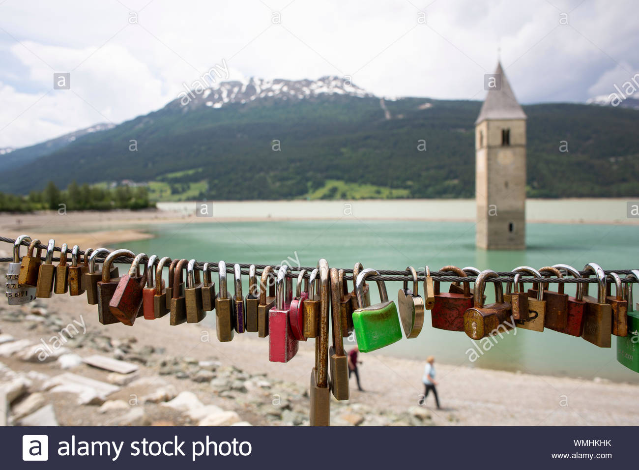 A shot of Lake Reschen in South Tyrol famous for the church belltower which is now all that can be seen of the town that once existed there Stock Photo