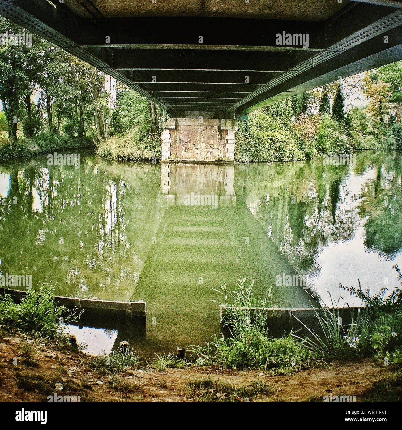 Bridge Reflected In Water Stock Photo