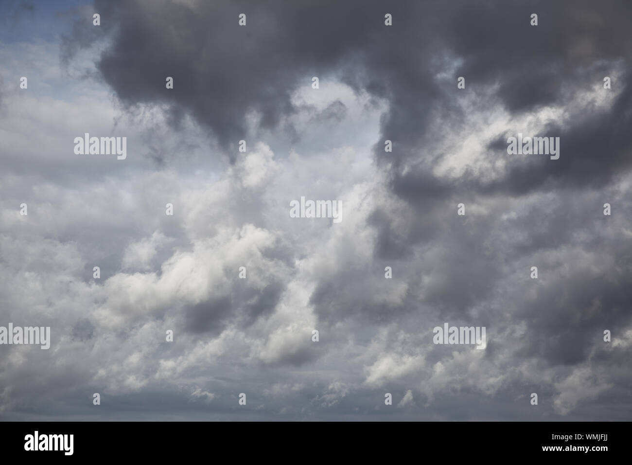 Autumn sky with grey heavy clouds, may be used as background Stock Photo