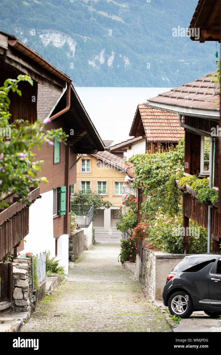 Traditional wooden houses and shops on the historic street of Brunngasse in the town of Brienz