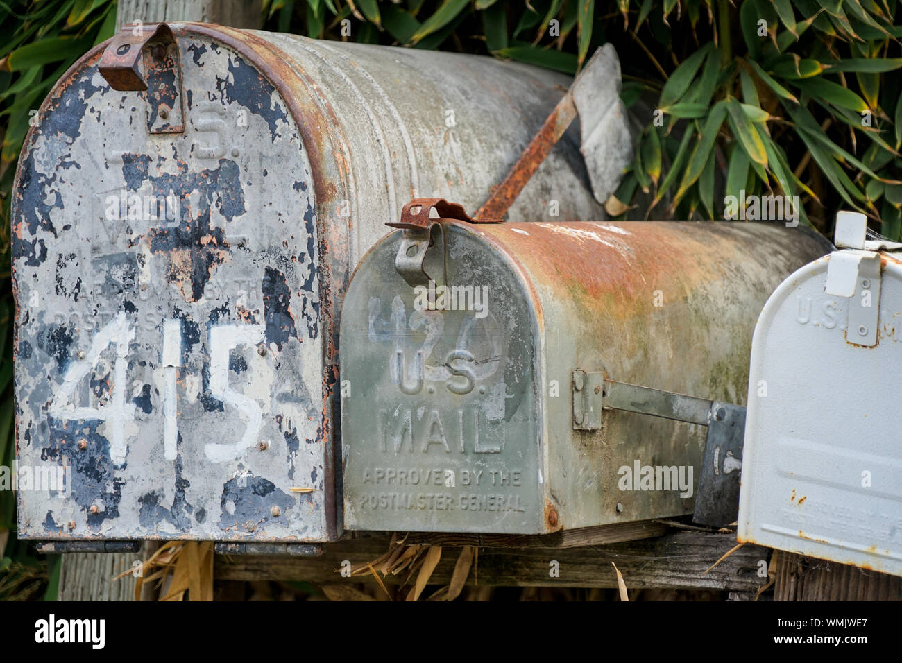 Old and wornd US mailboxes still doing their duty Stock Photo