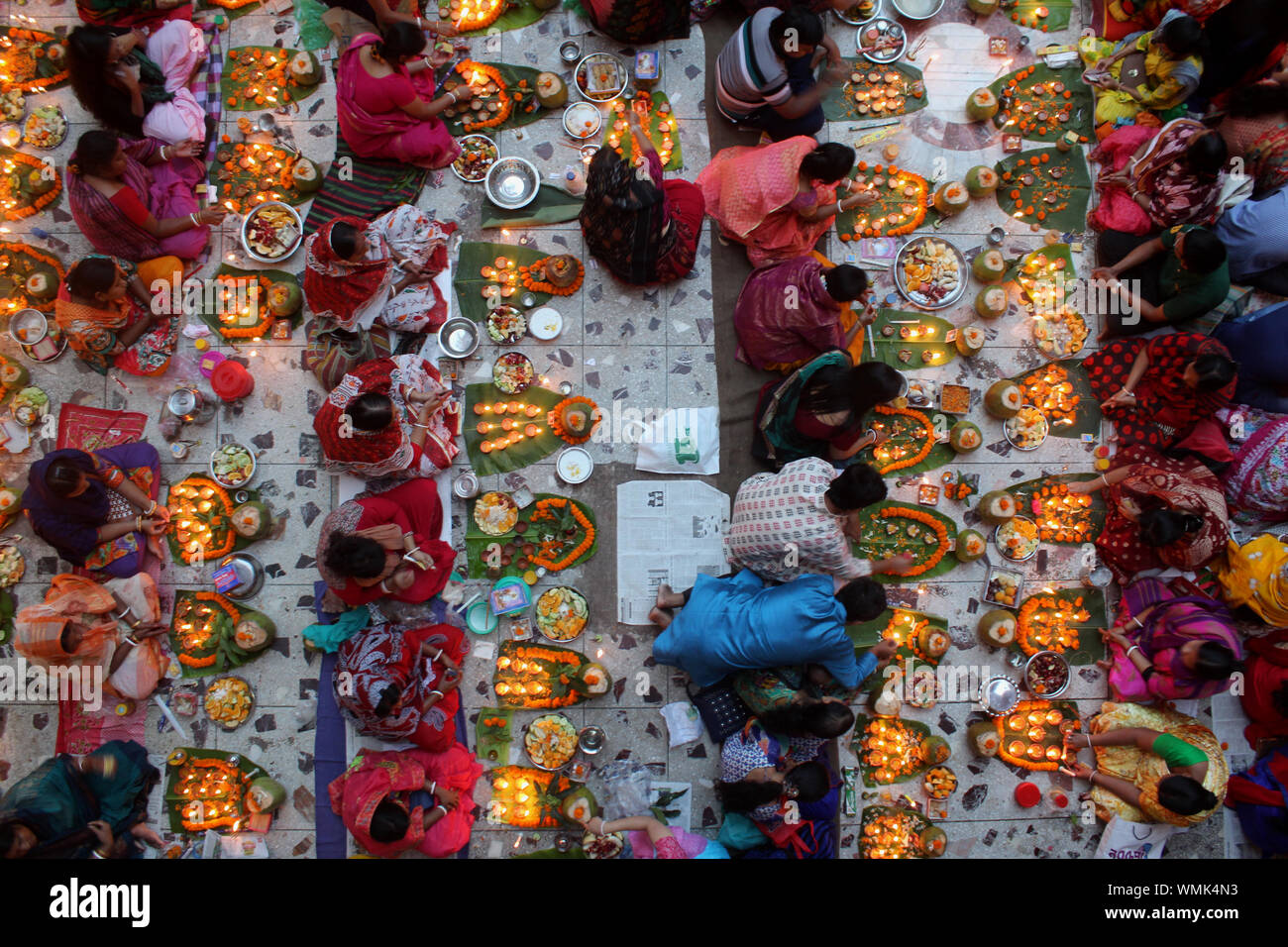 Directly Above Shot Of People With Illuminated Diyas During Religious Fasting Stock Photo