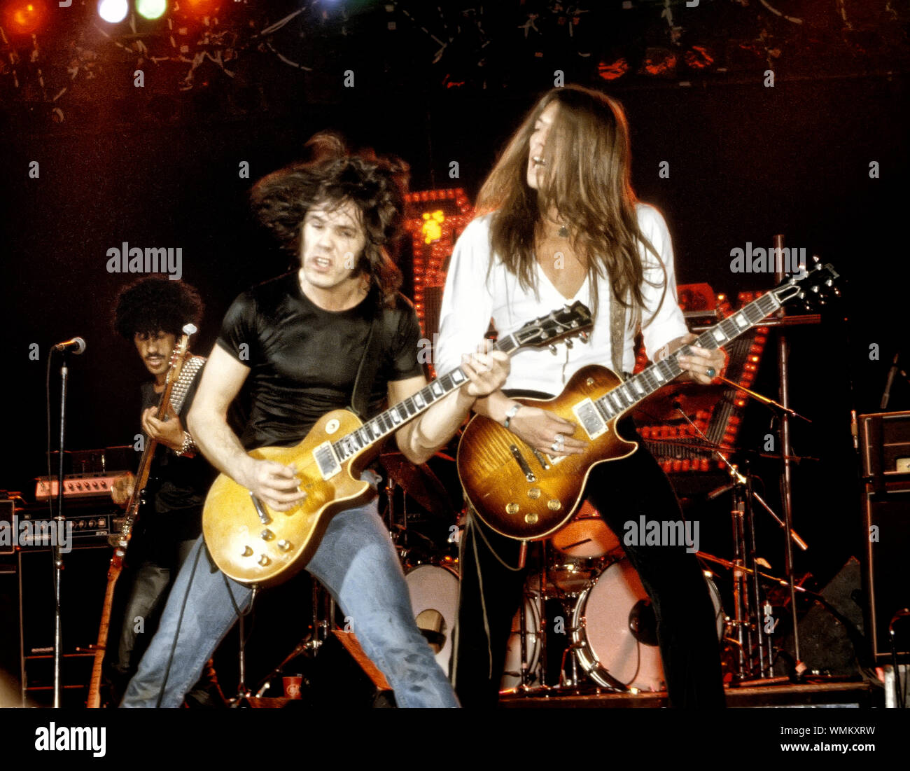 Phil Lynott, Gary Moore and Scott Gorham of Thin Lizzy onstage at the Palladium in NYC in September, 1978 Stock Photo