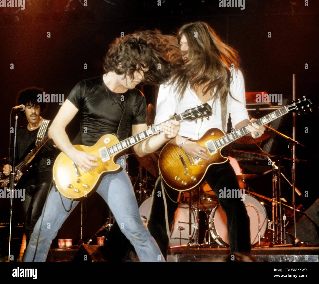 Phil Lynott, Gary Moore and Scott Gorham of Thin Lizzy onstage at the Palladium in NYC in September, 1978 Stock Photo