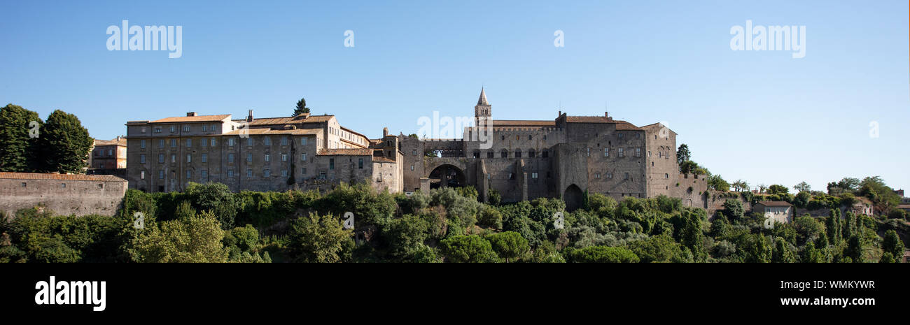 A view across the valley towards the Papal Palace and Cathedral complex in the medieval town of Viterbo in Lazio. Stock Photo