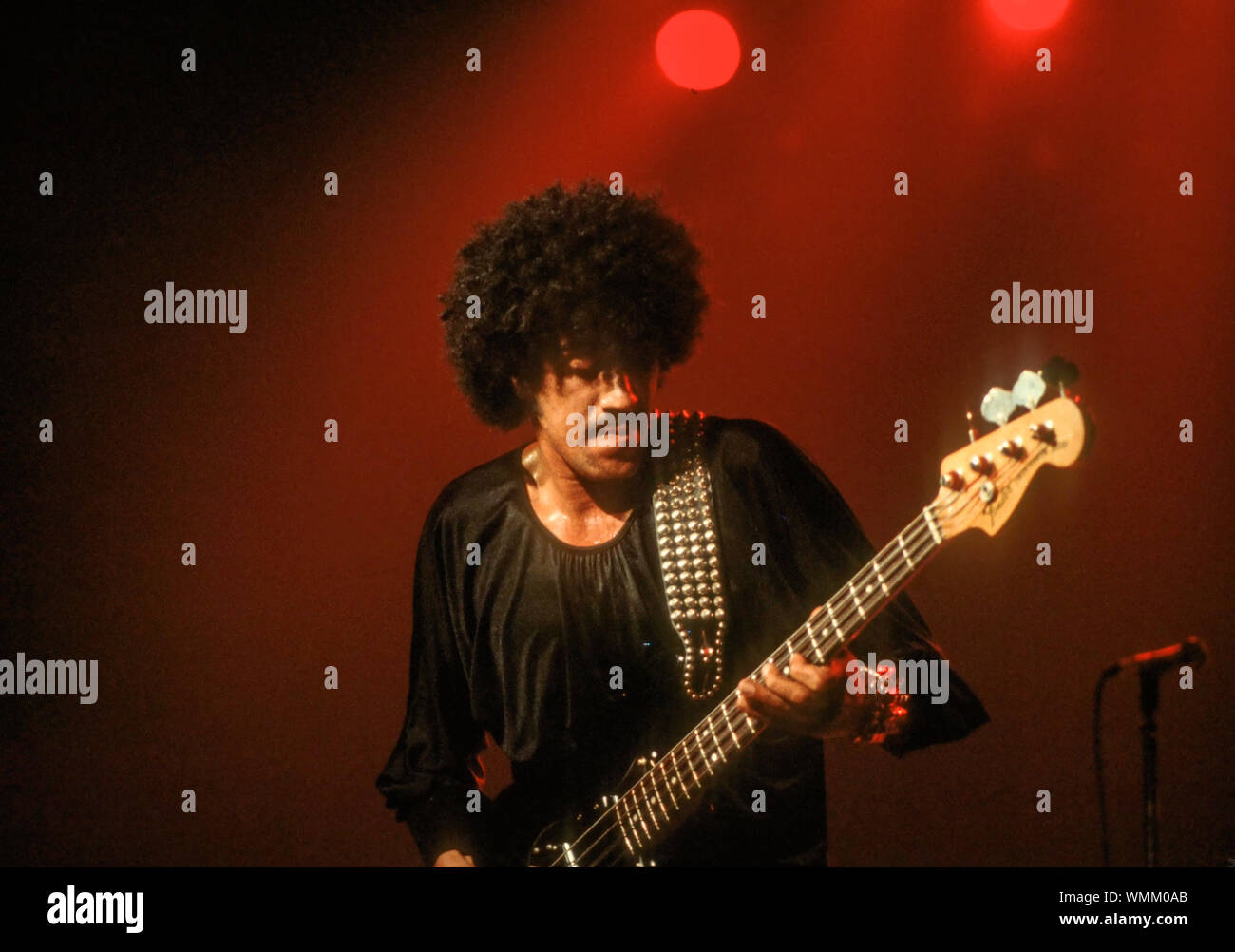 Phil Lynott of Thin Lizzy plays bass onstage at the Palladium in