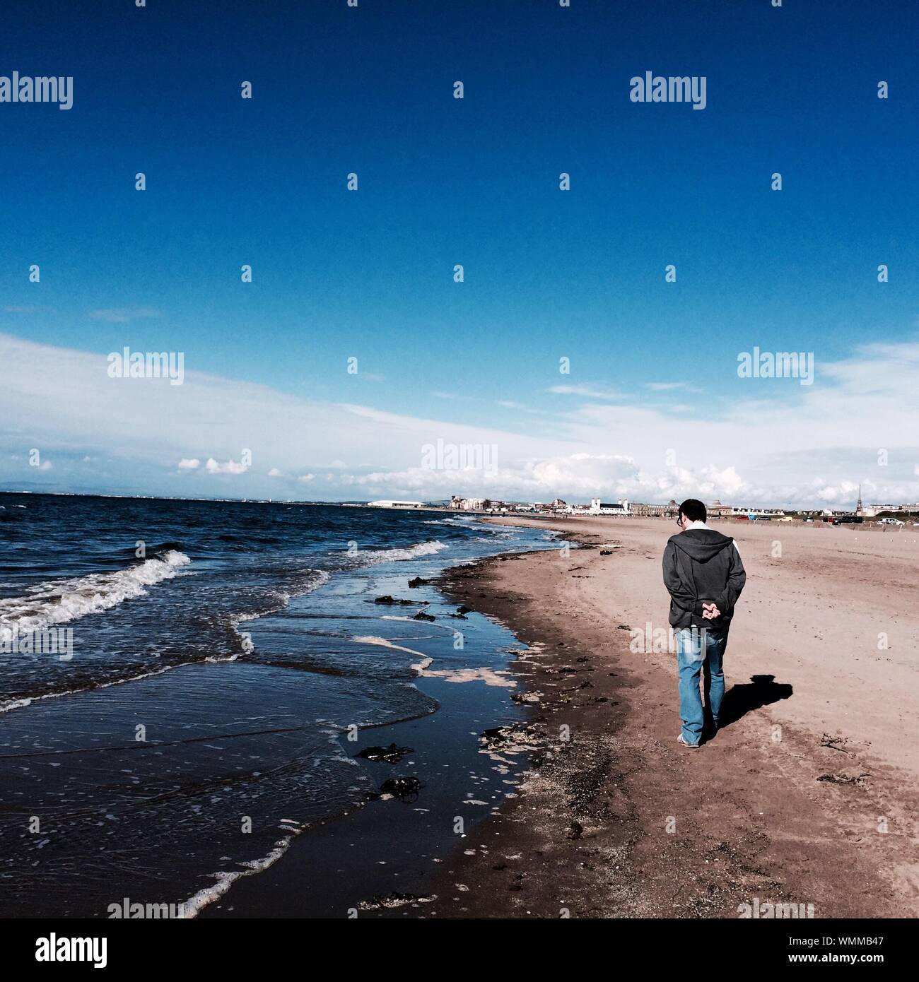 Man walking hands behind back hires stock photography and images Alamy