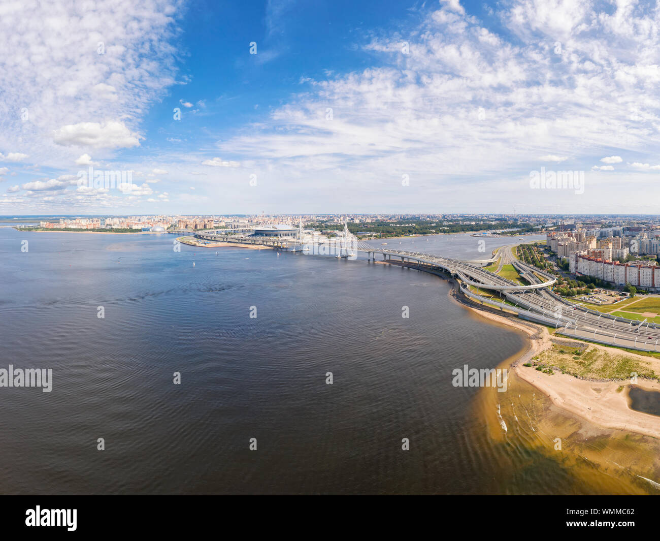 18 AUGUST 2019, Saint Petersburg, Russia. Large panoramic aerial seascape. Estuary of Neva river, elevated highway road, bridge and Krestovskiy stadiu Stock Photo