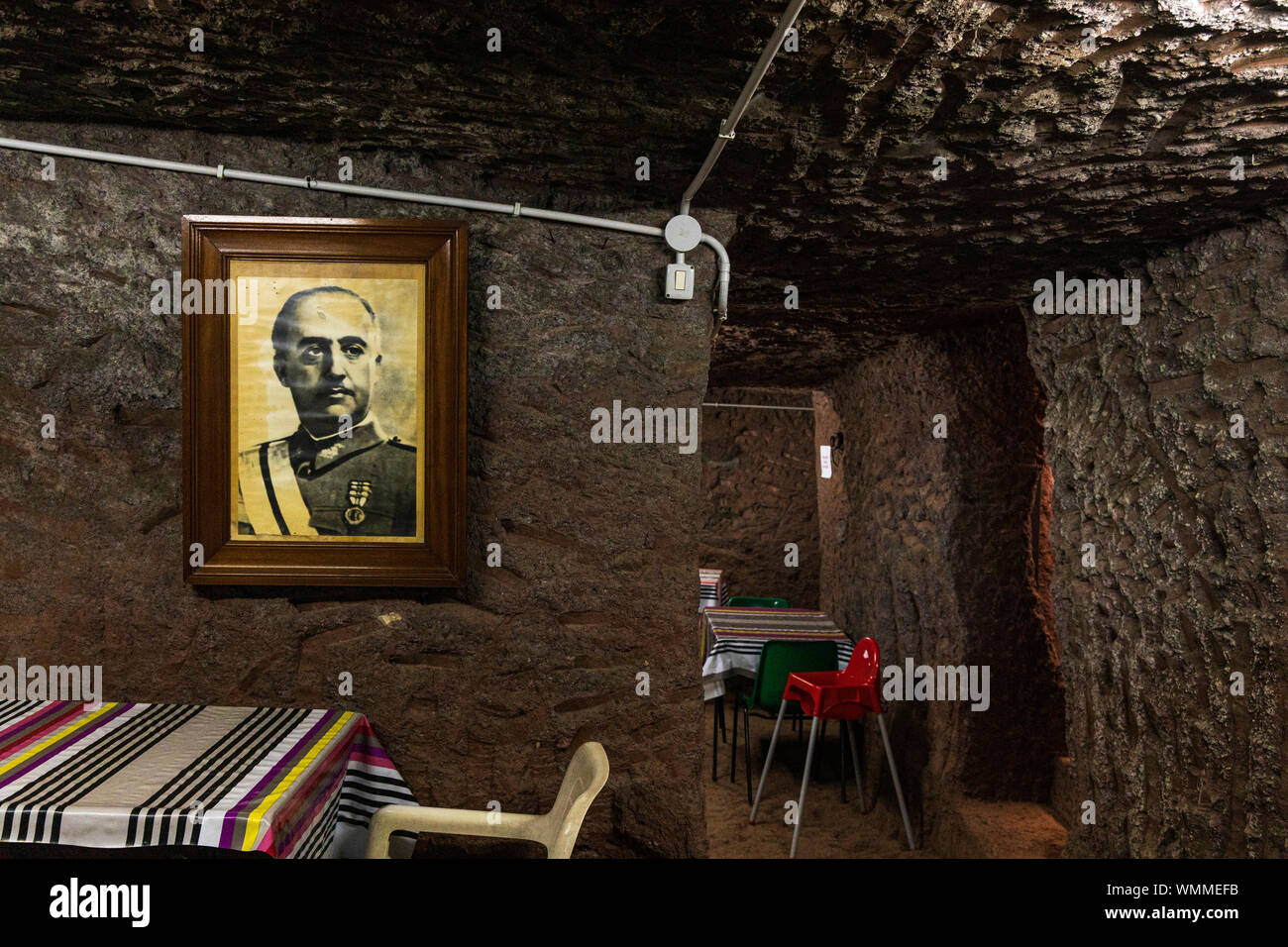 Black and white framed photograph of Franco, dictator of Spain hanging in a cave room of a Guachinche restaurant in Barranco Grande, Anaga, Tenerife, Stock Photo