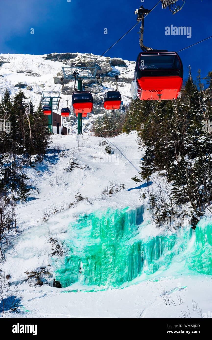 Stowe, Vermont, USA - Mar 17, 2005 The gondola lift over a green frozen waterfall dyed in honor of St. Pattys Day Stock Photo