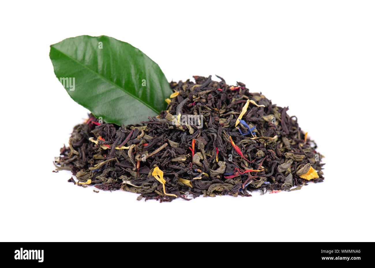 Black and green Ceylon tea with dry flowers - calendula, rose and cornflower petals, isolated on white background. Close up. Stock Photo