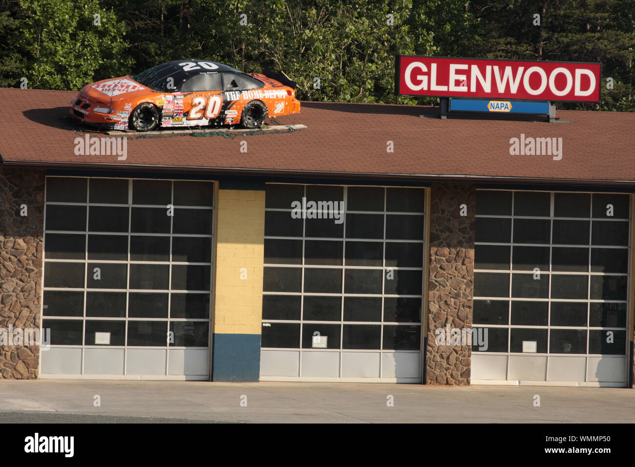 Race car as decor on the roof of auto body shop in Virginia, USA Stock