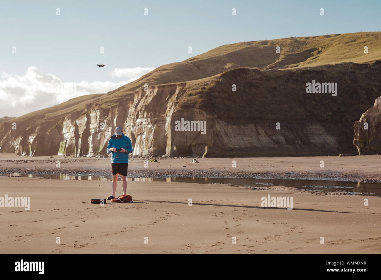 Man flying drone at the beach Stock Photo