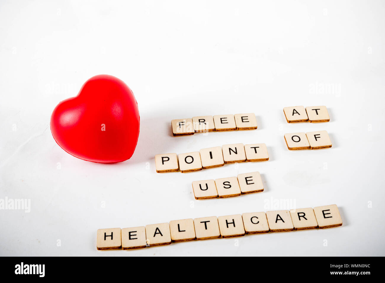 Healthcare concept showing a heart and the message free at point of use