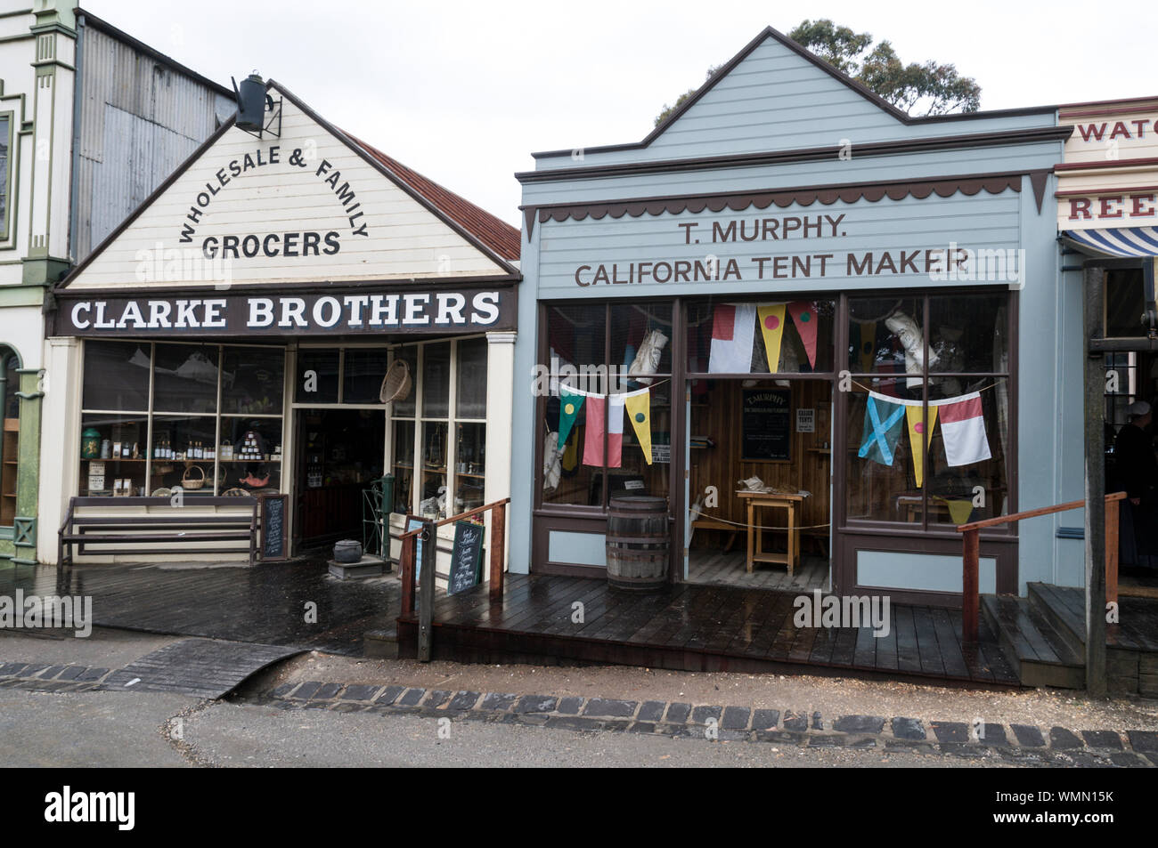 Main street with its old Victorian wooden buildings consisting of a variety of small shops, bar, hotel and music hall at the Sovereign Hill open-air-m Stock Photo