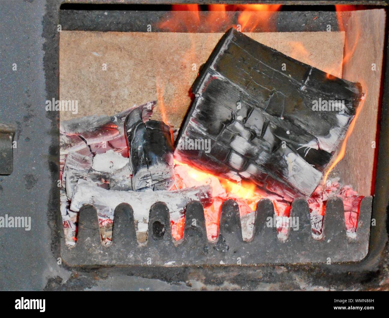 Close Up Of Wooden Log Burning At Fireplace Stock Photo 270916089