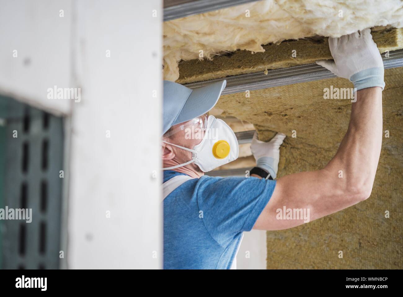 Manual Worker Working At Home Stock Photo