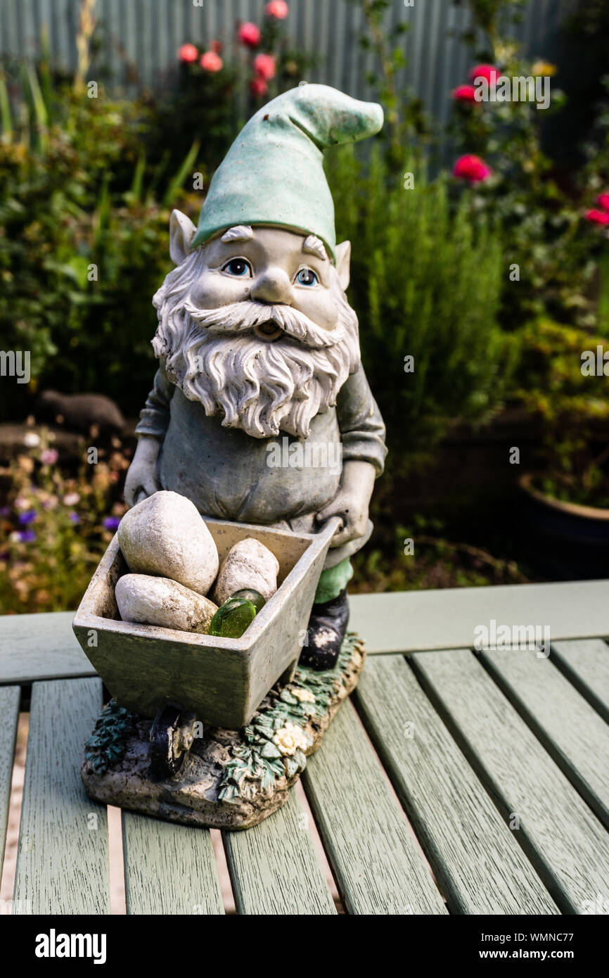 Garden gnome with wheelbarrow Stock Photo