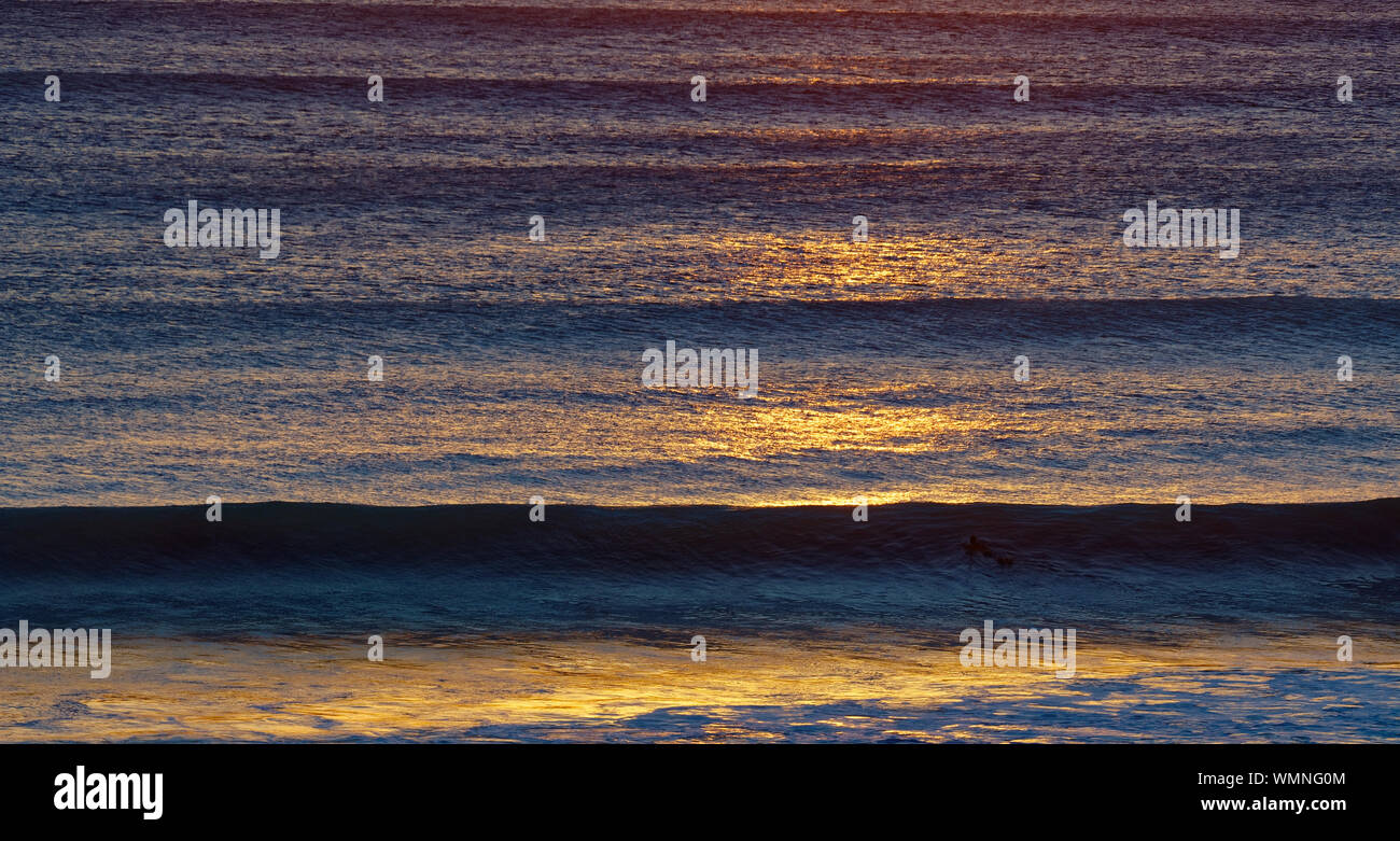 Waves at sunset, Kuta Beach, Bali Stock Photo