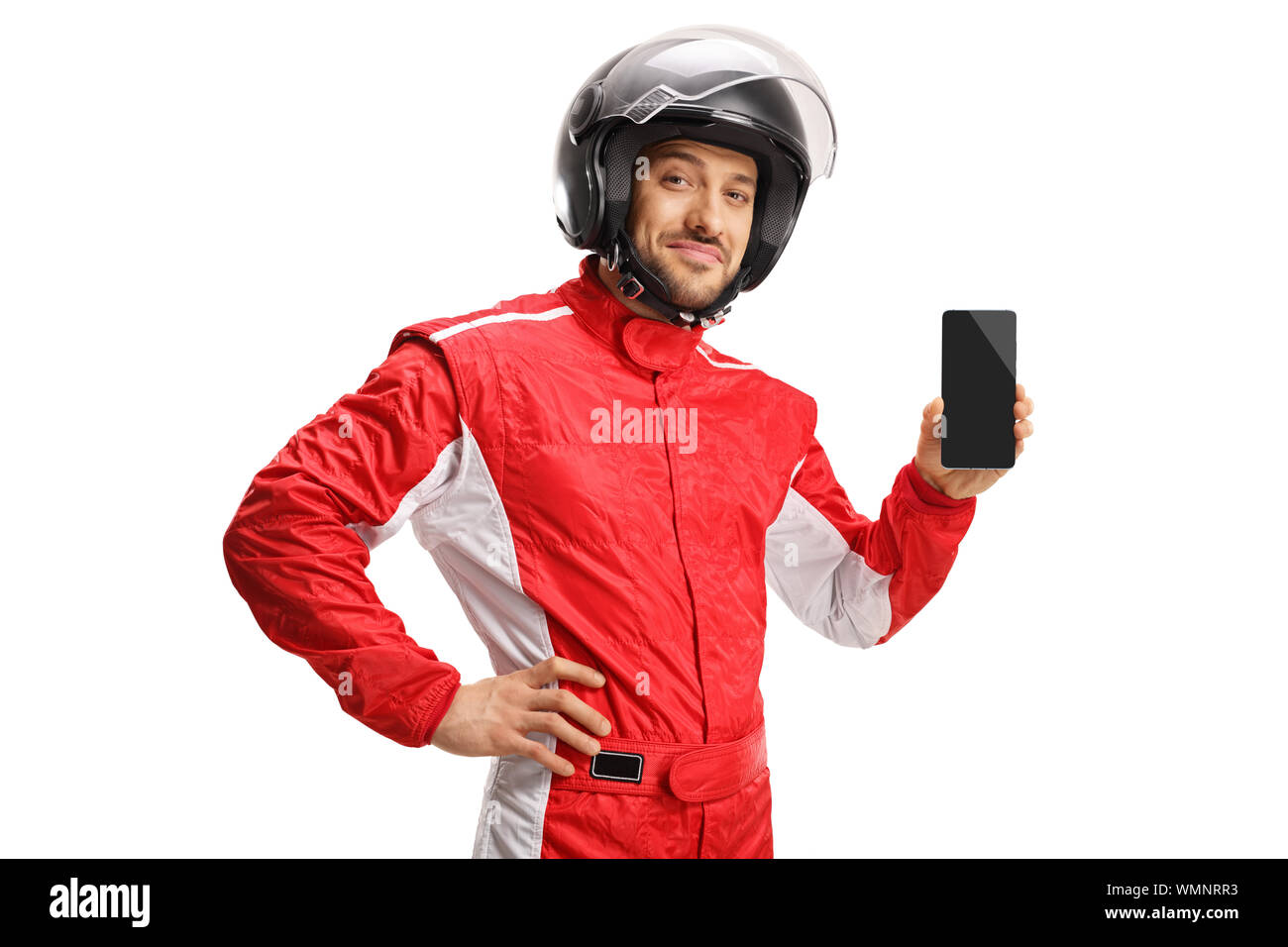 Car racer with a helmet holding a smartphone isolated on white background Stock Photo