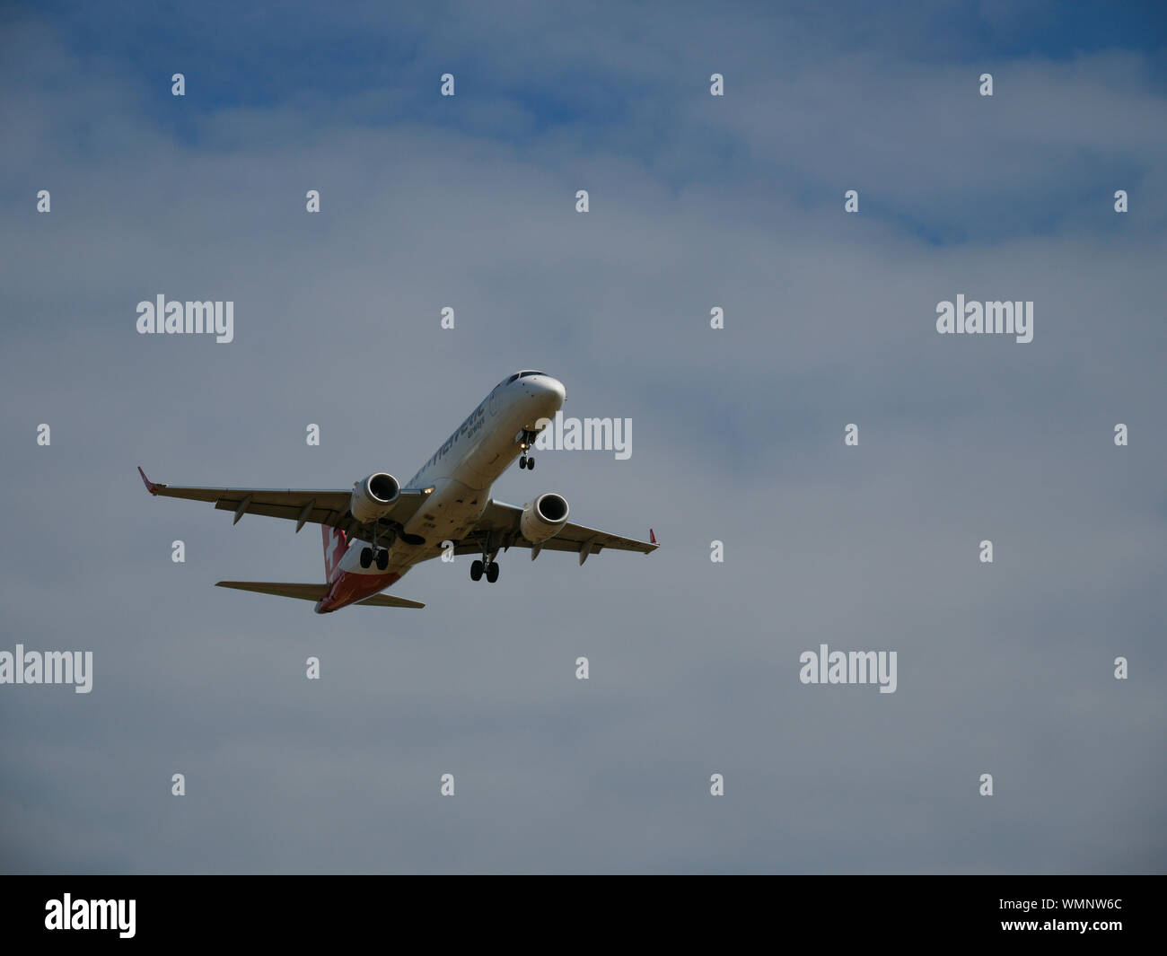 Helvetic airways landing at Zürich Airport Stock Photo