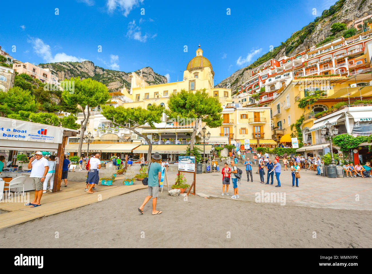 The sandy beach, cafes and shops at the coastal town of Positano Italy on the  Amalfi Coast of the Mediterranean Sea Stock Photo