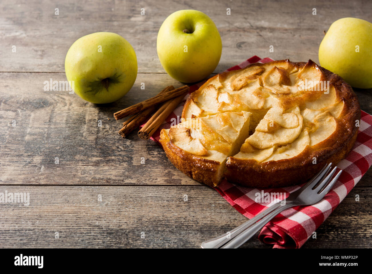 Homemade slice apple pie on wooden table. Copy space Stock Photo